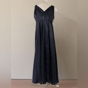 Aqua dress is blue with pink inside. back of the dress you cross the straps.